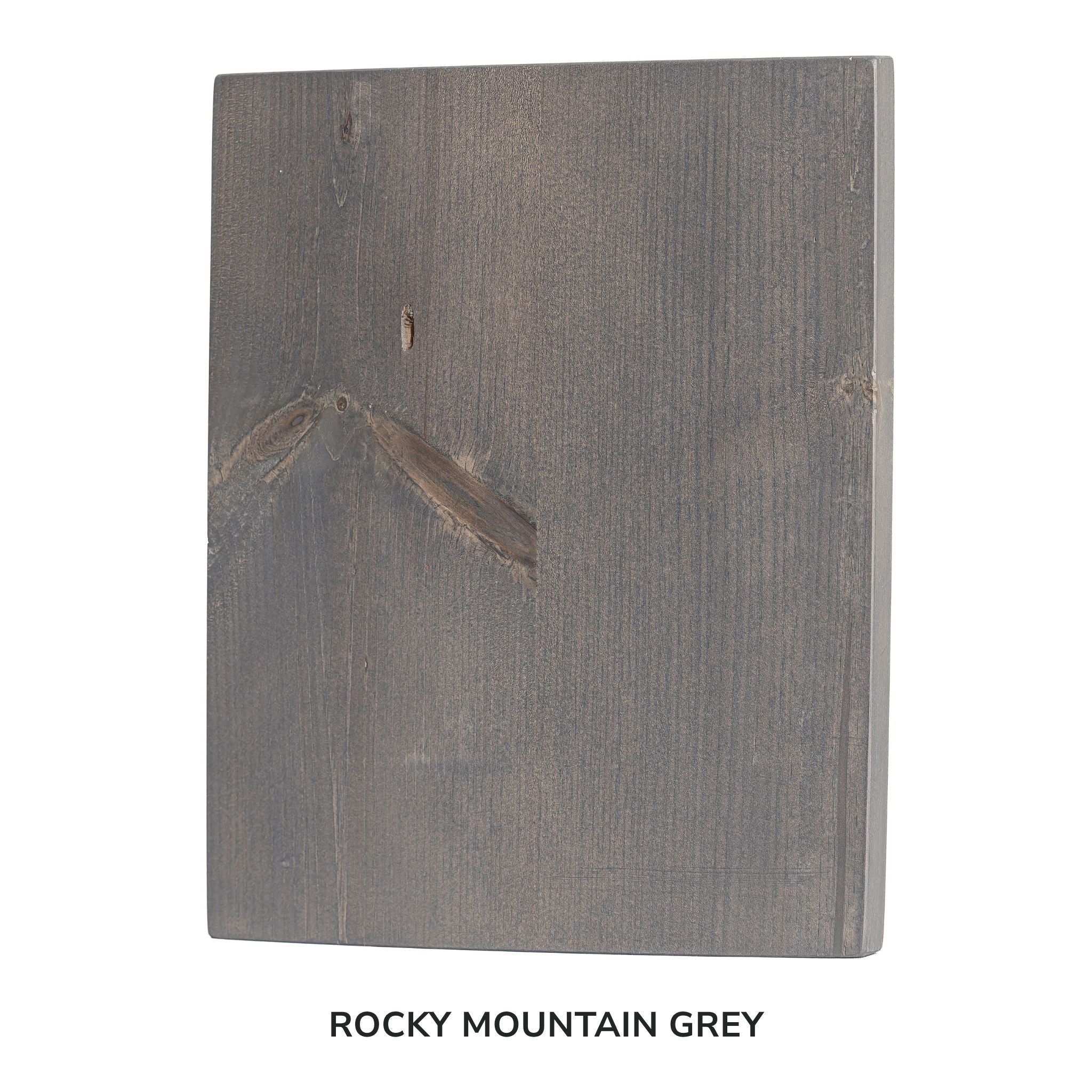 Wooden cutting board with 'Rocky Mountain Grey' label on a white background